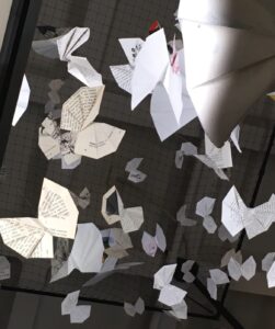 Pages of books, folded and hung to look like butterflies. Feel free to contact me!