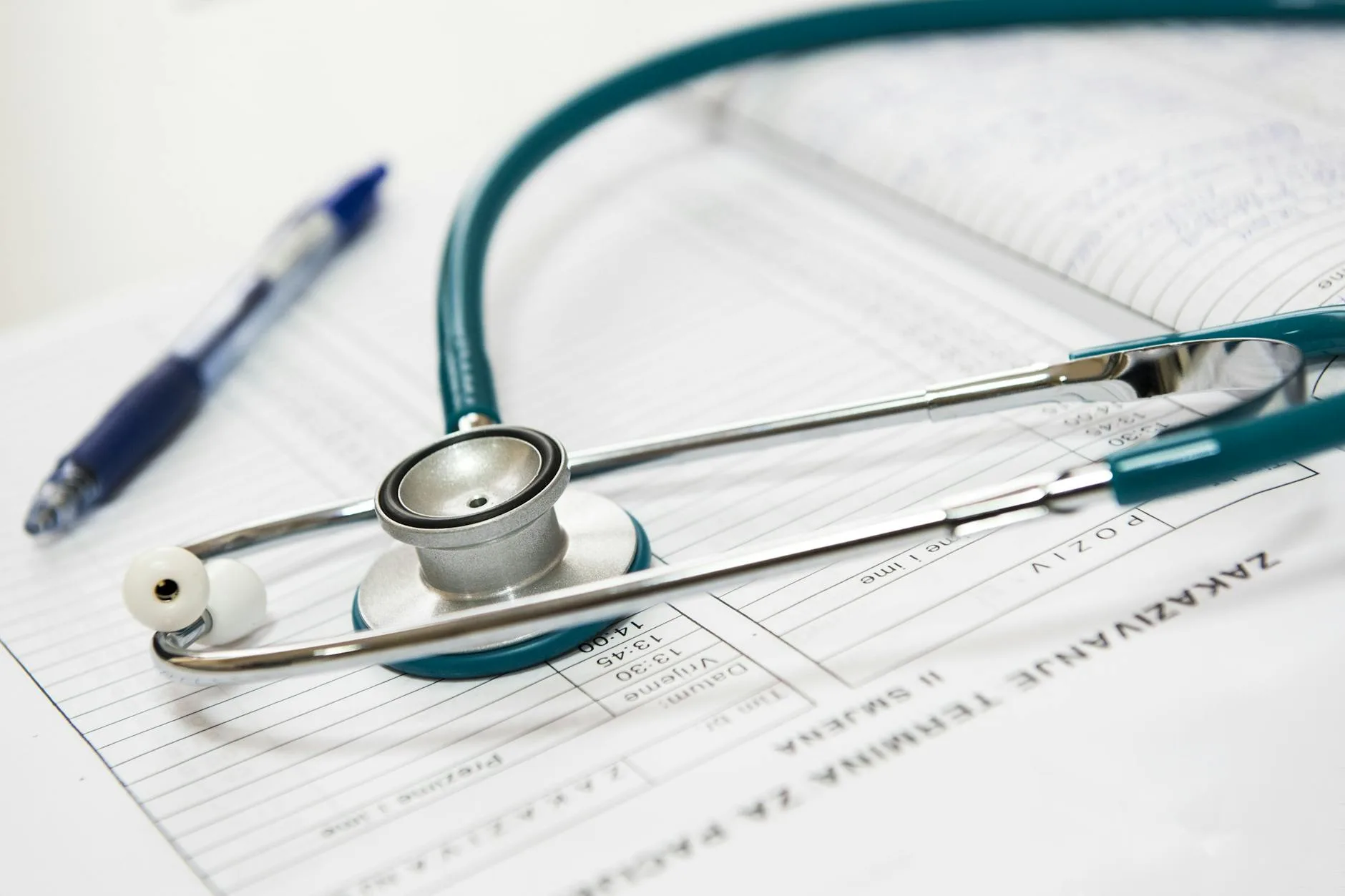 Close up photo of a stethoscope lying on a patient chart.