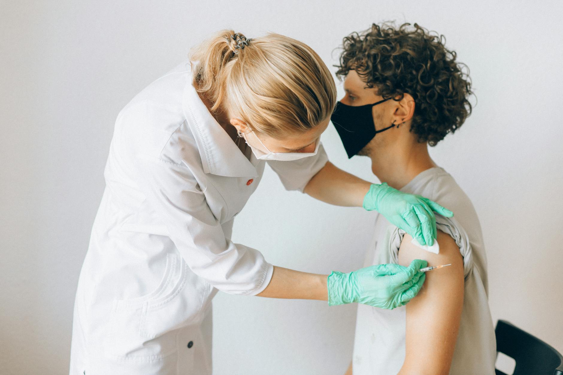 young man getting vaccinated